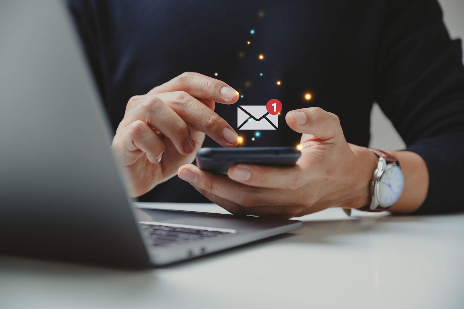 man checking email on a phone